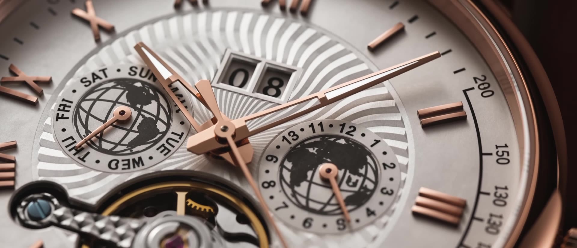 NORD Regent dial in macro — hands and world-time registers in warm light